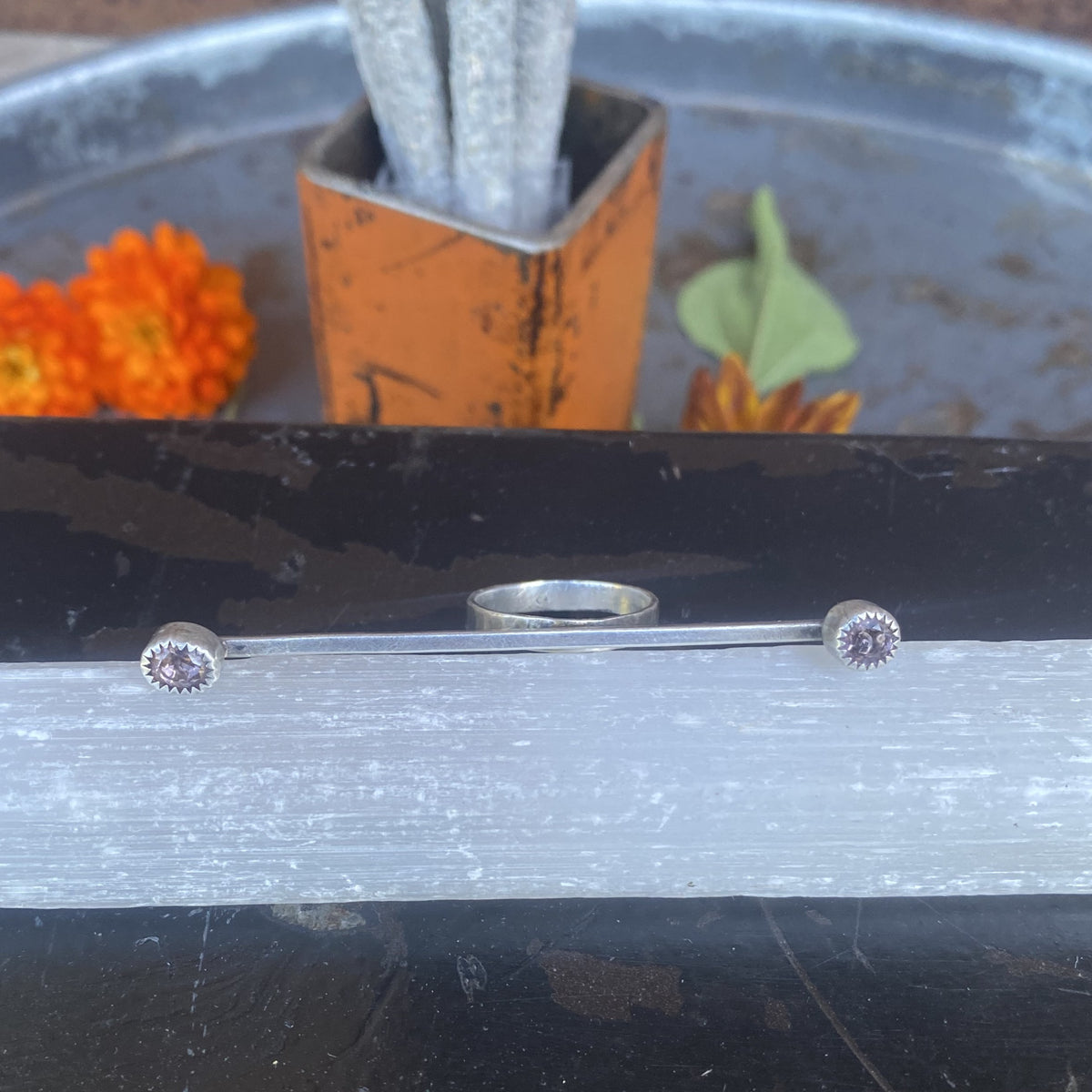 Sterling silver spinel multi-finger ring with gemstones at each end of sleek silver strip