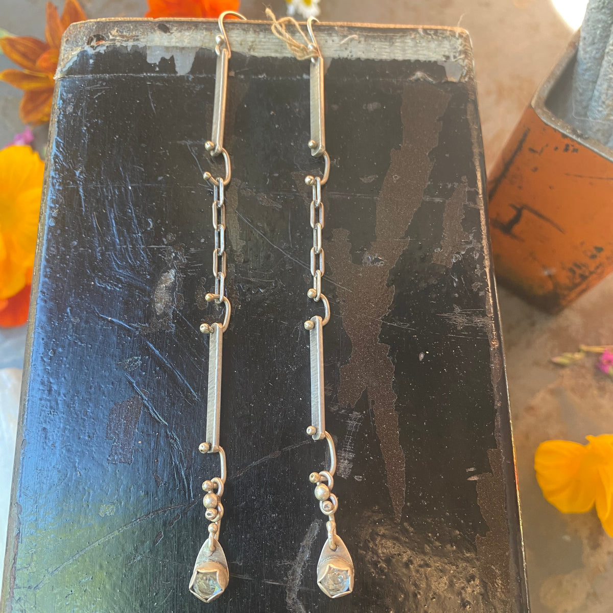 Handmade Handforged sterling silver earrings with an faceted Aquamarine gemstone. 