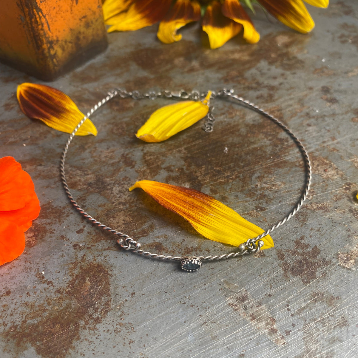tiny hand-cut kyanite gemstone on twisted sterling silver wire choker