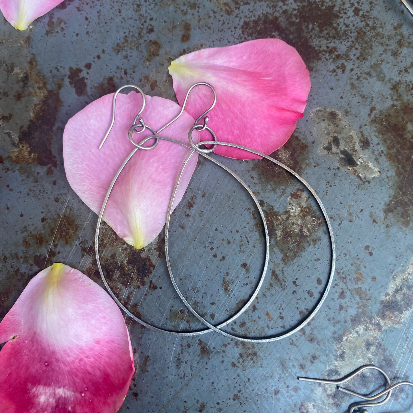 Dangle Oval Hoops out of Sterling Silver