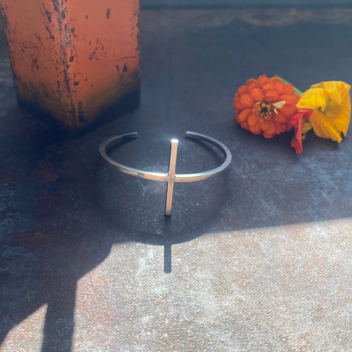 Handforged sterling silver cuff bracelet featuring a T-shaped center detail with a minimalist, industrial-inspired design by Zama Designz.
